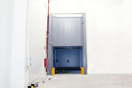 Vertical lift refrigerated door